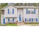Charming home featuring blue shutters, a welcoming front door, and manicured landscaping at 2816 Delco Ct, Raleigh, NC 27610