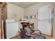 Well-equipped laundry room featuring a washer, salon basin, and storage space at 2816 Delco Ct, Raleigh, NC 27610