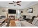 Open concept living room with wood floors, a ceiling fan, and comfortable seating at 2816 Delco Ct, Raleigh, NC 27610