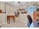 Cozy office space featuring desk, chair, shelving, and natural light from a window at 2816 Delco Ct, Raleigh, NC 27610