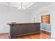 Stylish bar area with wood floors, paneled bar, and an open view to additional rooms at 286 Sea Mist Dr, Sanford, NC 27332