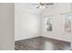 Bedroom with hardwood floors, ceiling fan, and natural light from two windows at 286 Sea Mist Dr, Sanford, NC 27332
