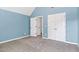 Carpeted bedroom with two closets and an ensuite bathroom at 286 Sea Mist Dr, Sanford, NC 27332
