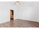 Spacious bedroom features wood-look floors, neutral walls, a ceiling fan, and a walk-in closet at 286 Sea Mist Dr, Sanford, NC 27332
