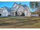 Charming two-story home with a manicured lawn, two-car garage, inviting entrance, and lush landscaping at 286 Sea Mist Dr, Sanford, NC 27332