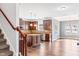 Open kitchen with stainless steel appliances, center island, and adjacent dining area at 286 Sea Mist Dr, Sanford, NC 27332