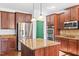 Bright kitchen features stainless steel appliances, kitchen island, and granite countertops at 286 Sea Mist Dr, Sanford, NC 27332