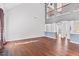 Sun-drenched living room with soaring ceilings, hardwood floors, and neutral paint at 286 Sea Mist Dr, Sanford, NC 27332