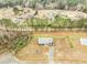 Overhead shot of the property surrounded by lush greenery, showcasing its serene and private location at 30 Golden Poppy Ln, Youngsville, NC 27596