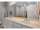Bright bathroom featuring dual sinks, vanity with marble counters, and a large mirror at 317 W Morgan St # 317, Raleigh, NC 27601