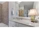 Modern bathroom featuring a marble countertop, white cabinets, a large mirror, and stylish fixtures at 317 W Morgan St # 317, Raleigh, NC 27601