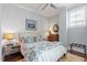Cozy bedroom with soft lighting, a ceiling fan, and a window at 317 W Morgan St # 317, Raleigh, NC 27601