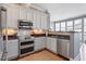 Well-appointed kitchen featuring stainless steel appliances, granite counters and abundant cabinet space at 317 W Morgan St # 317, Raleigh, NC 27601