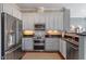 Modern kitchen with stainless steel appliances and plenty of cabinet space, flowing into an open living space at 317 W Morgan St # 317, Raleigh, NC 27601