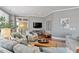 Inviting living room featuring neutral tones, stylish seating, and ample natural light from sliding glass doors at 317 W Morgan St # 317, Raleigh, NC 27601