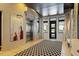 Modern lobby with a passenger elevator, abstract art, and patterned rug at 317 W Morgan St # 317, Raleigh, NC 27601