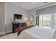 Comfortable main bedroom with a ceiling fan and slider to a private balcony at 317 W Morgan St # 317, Raleigh, NC 27601