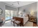 Tranquil main bedroom featuring a textured accent wall and private balcony access at 317 W Morgan St # 317, Raleigh, NC 27601