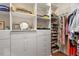 Organized walk-in closet with custom shelving, drawers, and ample storage space at 317 W Morgan St # 317, Raleigh, NC 27601