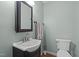 Compact bathroom with a sleek vanity, offering a clean and functional space at 323 E Stratford Dr, Henderson, NC 27537