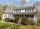 Charming two-story home with a welcoming front porch and well-maintained landscaping at 323 E Stratford Dr, Henderson, NC 27537