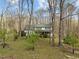 Beautiful two-story home surrounded by trees, offering a sense of privacy and seclusion at 323 E Stratford Dr, Henderson, NC 27537