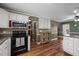 Open kitchen layout with sleek appliances, a breakfast bar, and seamless flow to dining at 323 E Stratford Dr, Henderson, NC 27537