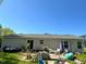An expansive backyard space with patio seating, a grill, and a patio at 35 Golden Poppy Ln, Youngsville, NC 27596