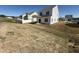 Sodded backyard with a covered patio and a white fence, providing a perfect space for outdoor enjoyment at 37 Furley St., Homesite 38, Sanford, NC 27330
