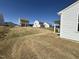 View of sodded backyard with houses in the background, showcasing the outdoor space and neighborhood setting at 37 Furley St., Homesite 38, Sanford, NC 27330