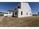 The backyard has sod and a covered patio, ideal for outdoor relaxation and entertainment near a vinyl fence at 37 Furley St., Homesite 38, Sanford, NC 27330