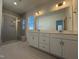 Elegant bathroom with double vanity sinks, quartz countertops, and a luxurious glass door shower at 37 Furley St., Homesite 38, Sanford, NC 27330
