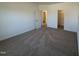 Well-lit bedroom with a bathroom and a walk-in closet that enhances the room's accessibility at 37 Furley St., Homesite 38, Sanford, NC 27330