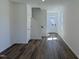 Inviting entryway featuring wood-look floors, a staircase, and a bright white front door for a modern, clean aesthetic at 37 Furley St., Homesite 38, Sanford, NC 27330