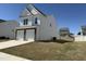 Attractive two-story home featuring a two-car garage, siding, and a yard, set in a residential area at 37 Furley St., Homesite 38, Sanford, NC 27330