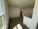 Upstairs loft area with neutral carpet, natural light from the window, and plenty of space at 37 Furley St., Homesite 38, Sanford, NC 27330