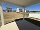 Patio view overlooking the sodded backyard, with a white fence, offering an ideal spot for outdoor living at 37 Furley St., Homesite 38, Sanford, NC 27330