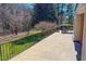 Spacious outdoor porch with seating area perfect for entertaining and overlooking the landscaped yard at 382 Wimbledon Dr, Roxboro, NC 27573