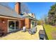 View of the home's backyard featuring an outdoor patio with seating at 382 Wimbledon Dr, Roxboro, NC 27573