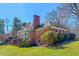 Brick home with a large yard, mature landscaping, chimney, walkout basement and patio at 382 Wimbledon Dr, Roxboro, NC 27573