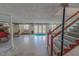 Finished basement with a fireplace, staircase, and access to the backyard with a blue rug at 382 Wimbledon Dr, Roxboro, NC 27573