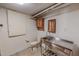 Functional basement bathroom includes a stainless steel utility sink, toilet and storage cabinet at 382 Wimbledon Dr, Roxboro, NC 27573