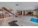 Spacious basement featuring a fireplace, kitchenette, and ample room for recreation and relaxation at 382 Wimbledon Dr, Roxboro, NC 27573