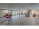 Finished basement with staircase, full windows, and doors to the exterior at 382 Wimbledon Dr, Roxboro, NC 27573