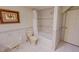 This bathroom is decorated with tiled walls, bathtub, shower, and a toilet at 382 Wimbledon Dr, Roxboro, NC 27573