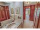 Traditional bathroom with marble floors, neutral tile backsplash, and classic wood trim at 382 Wimbledon Dr, Roxboro, NC 27573