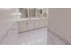 Bathroom featuring dual sinks, tile floor, and a bathtub and shower combo with grab bars at 382 Wimbledon Dr, Roxboro, NC 27573