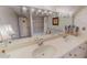 Bathroom featuring dual sinks, tile floor, a bathtub and shower combo with grab bars at 382 Wimbledon Dr, Roxboro, NC 27573