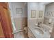 Well-maintained bathroom featuring a stylish marble countertop and traditional fixtures at 382 Wimbledon Dr, Roxboro, NC 27573