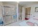 Bright bathroom features glass-enclosed shower, toilet, and double sink vanity at 382 Wimbledon Dr, Roxboro, NC 27573